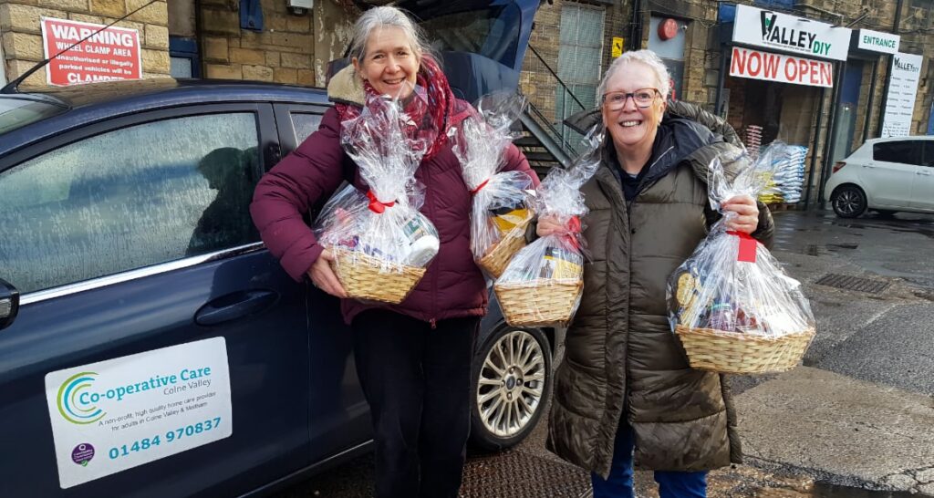 Board members delivering Christmas hampers to the people for whom we provide.